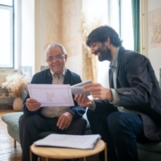 A Persian Accountant Talking To Elderly Man